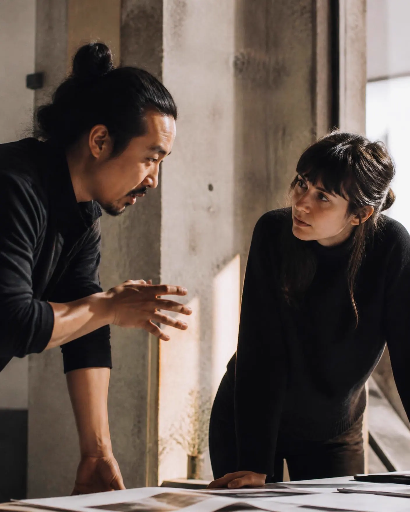 Two figures in focused conversation in a training environment